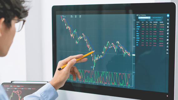 Trader Looks at Chart (key factors for options trading)